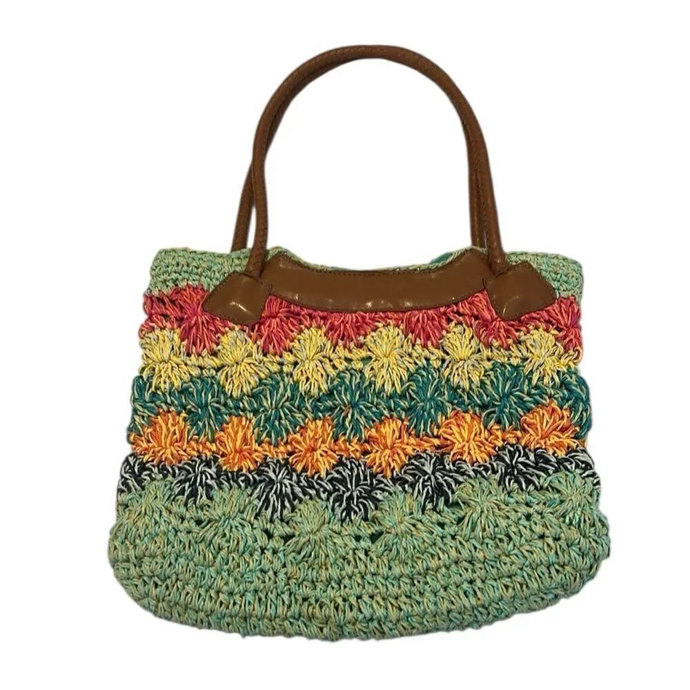Multicolor straw tote with a faux leather woven handle EUC